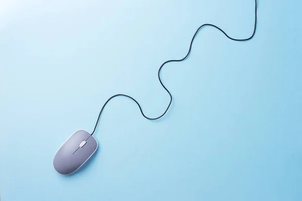 Gray computer mouse over blue background — Stock Photo, Image