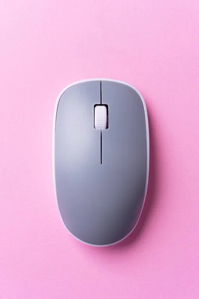 Wireless Gray computer mouse over pink background — Stock Photo, Image