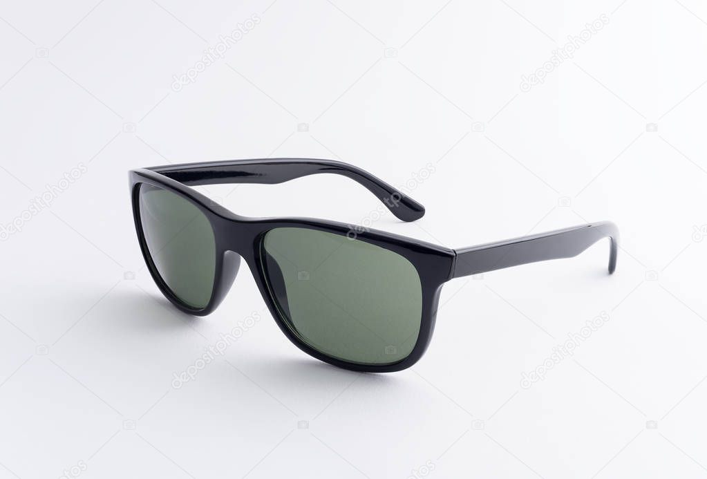 Black sunglasses over white background