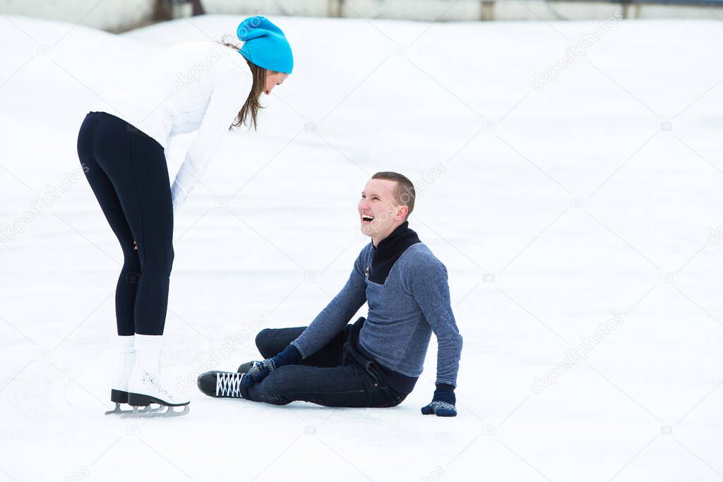 Beautiful, attractive couple on the ice rink