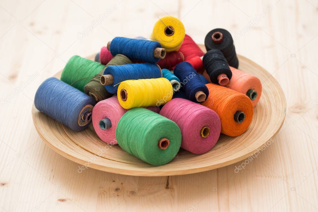 Tailoring. Many colorful threads on the table