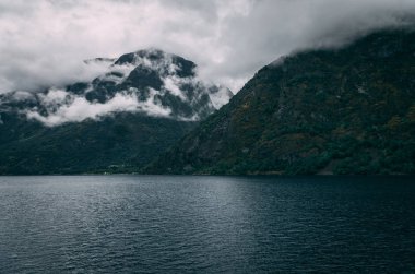 Clouds on mountain near fjords in Norway