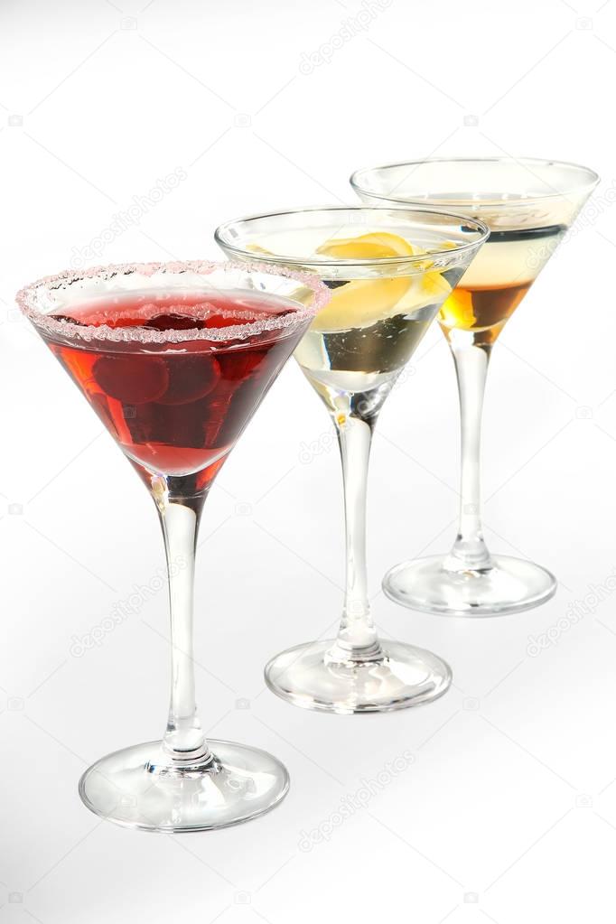 Alcoholic cocktails and soft drinks on a white background