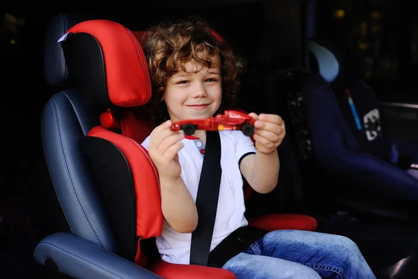 Baby boy sitting in a child car seat — Stock Photo, Image