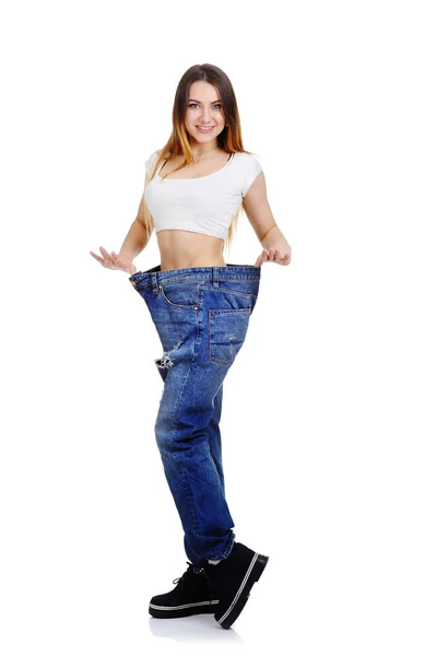 Schattig jong meisje in jeans groot formaat. — Stockfoto