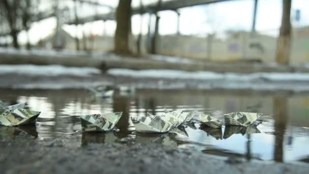 Paper ships out of dollars in water — Stock Video