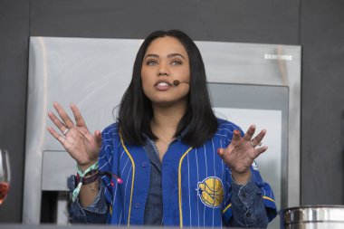Napa, CA/USA: 5/26/17: Ayesha Curry interacts with the crowd at the culinary stage during BottleRock in Napa, California. She's a Canadian-American actress, celebrity cook, cookbook author, and television personality.