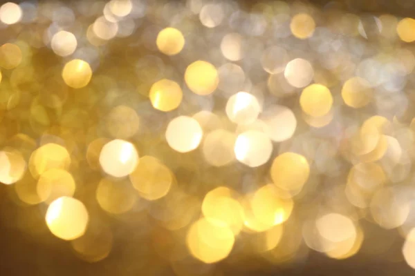 Abstrakte goldene Bokeh Hintergrund mit leuchtenden Defokus funkelt — Stockfoto