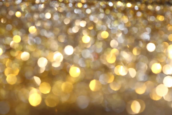 Abstrakte goldene Bokeh Hintergrund mit leuchtenden Defokus funkelt — Stockfoto