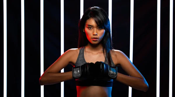 Girl exercises in Modern Neon Boxing Gym heavily — Stock Photo, Image