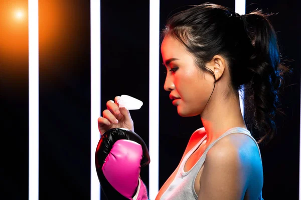 Girl exercises in Modern Neon Boxing Gym heavily — Stock Photo, Image
