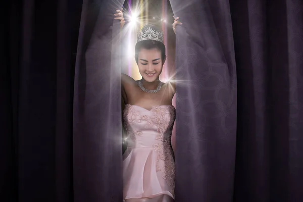 Concept of Beautiful Miss Pageant Queen Contest opens Stage Curtain as Door windows of New Opportunity, Life, chance, Work. Asian Woman Changes everything Next Day after winning Diamond Crown.