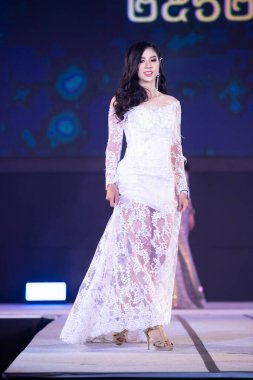 Udonthani, Thailand - July 23, 2019 ; Miss Thailand 2019 Udonthani, Beautiful Contestants present fashion show on stage with evening gown Colorful Dress Costume at Montatip Hall