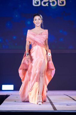 Udonthani, Thailand - July 23, 2019 ; Miss Thailand 2019 Udonthani, Beautiful Contestants present fashion show on stage with evening gown Colorful Dress Costume at Montatip Hall