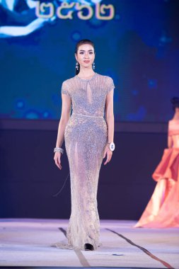 Udonthani, Thailand - July 23, 2019 ; Miss Thailand 2019 Udonthani, Beautiful Contestants present fashion show on stage with evening gown Colorful Dress Costume at Montatip Hall