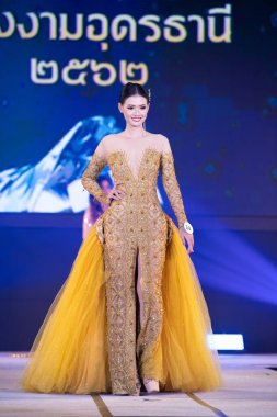 Udonthani, Thailand - July 23, 2019 ; Miss Thailand 2019 Udonthani, Beautiful Contestants present fashion show on stage with evening gown Colorful Dress Costume at Montatip Hall