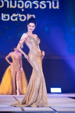 Udonthani, Thailand - July 23, 2019 ; Miss Thailand 2019 Udonthani, Beautiful Contestants present fashion show on stage with evening gown Colorful Dress Costume at Montatip Hall