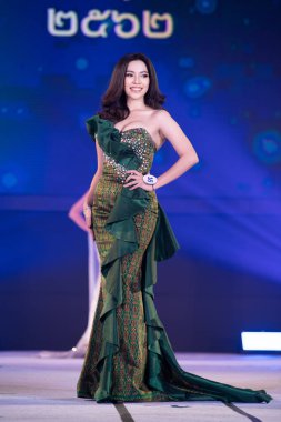 Udonthani, Thailand - July 23, 2019 ; Miss Thailand 2019 Udonthani, Beautiful Contestants present fashion show on stage with evening gown Colorful Dress Costume at Montatip Hall
