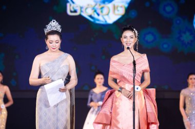 Udonthani, Thailand - July 23, 2019 ; Miss Thailand 2019 Udonthani, Beautiful Contestants answer Interview session to judge on stage with evening gown Colorful at Montatip Hall