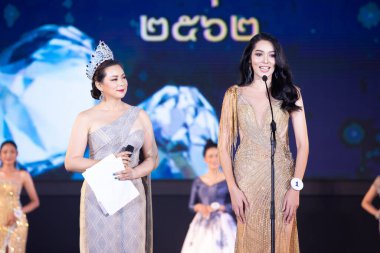 Udonthani, Thailand - July 23, 2019 ; Miss Thailand 2019 Udonthani, Beautiful Contestants answer Interview session to judge on stage with evening gown Colorful at Montatip Hall