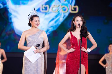 Udonthani, Thailand - July 23, 2019 ; Miss Thailand 2019 Udonthani, Beautiful Contestants answer Interview session to judge on stage with evening gown Colorful at Montatip Hall