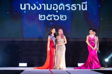 Udonthani, Thailand - July 23, 2019 ; Miss Thailand 2019 Udonthani, Beautiful Contestants receive Winner Sash Diamond Crown Awards on stage with evening gown Colorful at Montatip Hall