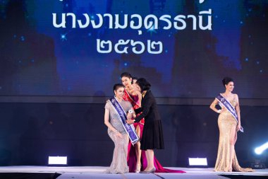 Udonthani, Thailand - July 23, 2019 ; Miss Thailand 2019 Udonthani, Beautiful Contestants receive Winner Sash Diamond Crown Awards on stage with evening gown Colorful at Montatip Hall