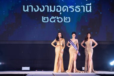 Udonthani, Thailand - July 23, 2019 ; Miss Thailand 2019 Udonthani, Beautiful Contestants receive Winner Sash Diamond Crown Awards on stage with evening gown Colorful at Montatip Hall