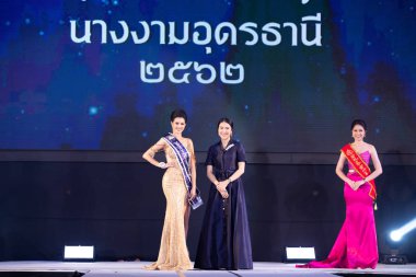 Udonthani, Thailand - July 23, 2019 ; Miss Thailand 2019 Udonthani, Beautiful Contestants receive Winner Sash Diamond Crown Awards on stage with evening gown Colorful at Montatip Hall