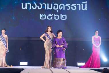Udonthani, Thailand - July 23, 2019 ; Miss Thailand 2019 Udonthani, Beautiful Contestants receive Winner Sash Diamond Crown Awards on stage with evening gown Colorful at Montatip Hall