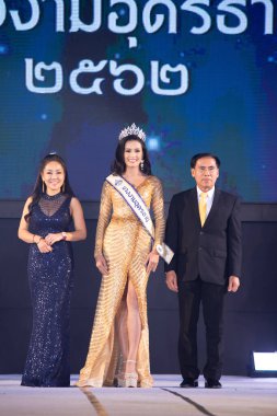 Udonthani, Thailand - July 23, 2019 ; Miss Thailand 2019 Udonthani, Beautiful Contestants receive Winner Sash Diamond Crown Awards on stage with evening gown Colorful at Montatip Hall