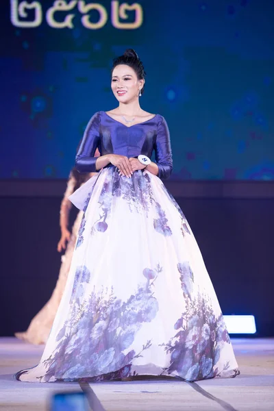 Udonthani, Thailand - July 23, 2019 ; Miss Thailand 2019 Udonthani, Beautiful Contestants present fashion show on stage with evening gown Colorful Dress Costume at Montatip Hall