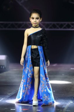 Bangkok, Thailand - July 16, 2017 ; Kid Fashion Show Alicio with  stain lighting hill tribe style at Nakarin Place
