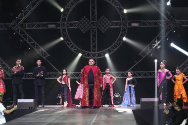 Bangkok, Thailand - July 16, 2017 ; Kid Fashion Show Alicio with  stain lighting hill tribe style at Nakarin Place