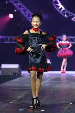 Bangkok, Thailand - July 16, 2017 ; Kid Fashion Show Alicio with  stain lighting hill tribe style at Nakarin Place