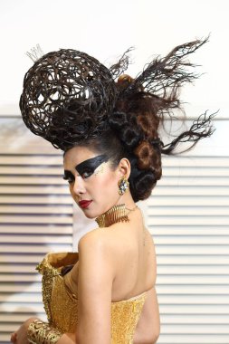 Bangkok, Thailand - August 11, 2017 ; Hair Fashion Show from Chalachol Academy, presenting hair design on catwalk stage in Central Department Store, both man and woman style with gown dress
