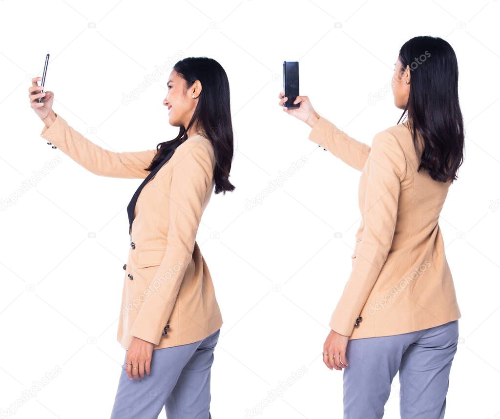 Portrait half body 20s 30s Asian Business Woman Stand in cream Formal proper Suit pants, studio lighting white background isolated, collage group pack hold smart phone photo selfie, rear back view
