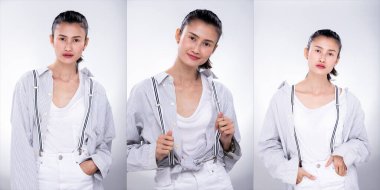 Kolaj Grubu 'nun Moda Genç Asyalı Sıska Kadın Paketi beyaz gömlek askısı takıyor ve çekici bir görünüm sergiliyor. Stüdyo Işıklandırma beyaz Arkaplan tecrit edilmiş telif alanı