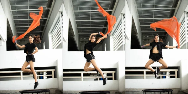 Asian Jumping Girl Model Skacze Trampolinie Rzuca Czerwony Szalik Powietrzu — Zdjęcie stockowe