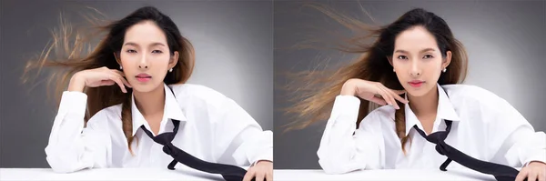 Kahverengi Kulaklı Beyaz Tişörtlü Saçları Havada Uçuşan Genç Asyalı Kadın — Stok fotoğraf