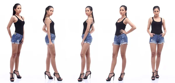 亚洲20多岁女子站着黑色大牛仔短裤和高跟鞋 工作室点亮白色背景隔离360 — 图库照片