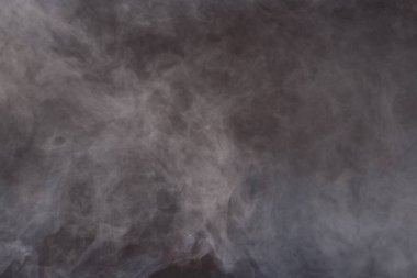 Dense Fluffy Puffs of White Smoke and Fog on Black Background, Abstract Smoke Clouds, All Movement Blurred, intention out of focus, and high low exposure contrast, copy space for text logo clipart