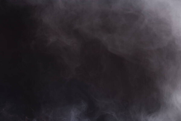Dense Fluffy Puffs of White Smoke and Fog on Black Background, Abstract Smoke Clouds, All Movement Blurred, intention out of focus, and high low exposure contrast, copy space for text logo