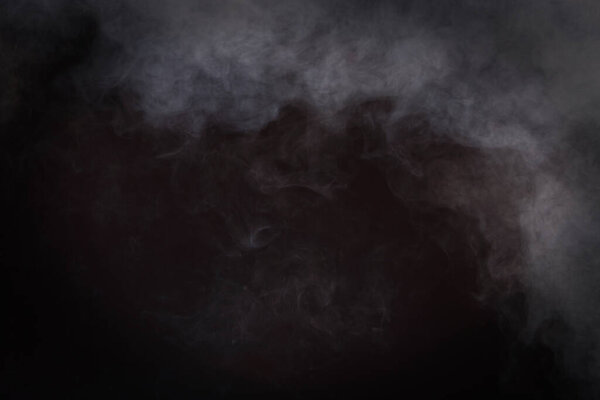 Dense Fluffy Puffs of White Smoke and Fog on Black Background, Abstract Smoke Clouds, All Movement Blurred, intention out of focus, and high low exposure contrast, copy space for text logo