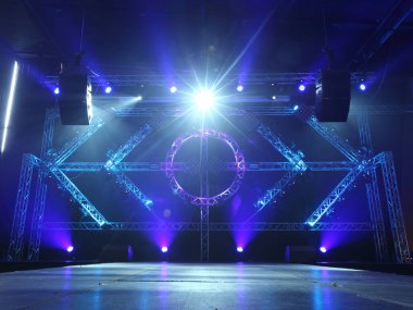 Empty Runway Fashion Show catwalk with moving beam lighting along walk way, background stage ramp