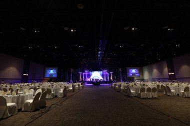 Udonthani, Thailand ; May 27, 2018 - Stage Contest at Central Convention Hall, Empty Performance Runway Fashion Show with LCD LED Screen lighting, background stage ramp Gala Dinner table VIP