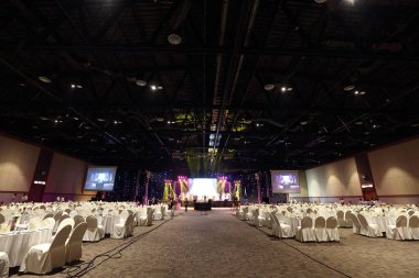 Udonthani, Thailand ; May 27, 2018 - Stage Contest at Central Convention Hall, Empty Performance Runway Fashion Show with LCD LED Screen lighting, background stage ramp Gala Dinner table VIP