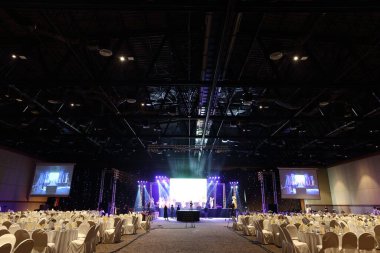 Udonthani, Thailand ; May 27, 2018 - Stage Contest at Central Convention Hall, Empty Performance Runway Fashion Show with LCD LED Screen lighting, background stage ramp Gala Dinner table VIP