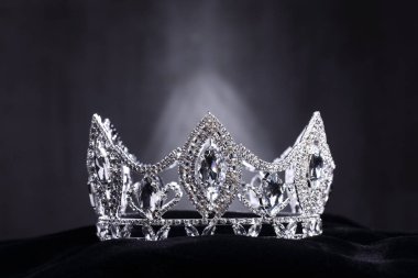 Diamond Silver Crown for Miss Pageant Beauty Contest, Crystal Tiara jewelry decorated gems stone and abstract dark background on black velvet fabric cloth, Macro photography copy space for text logo