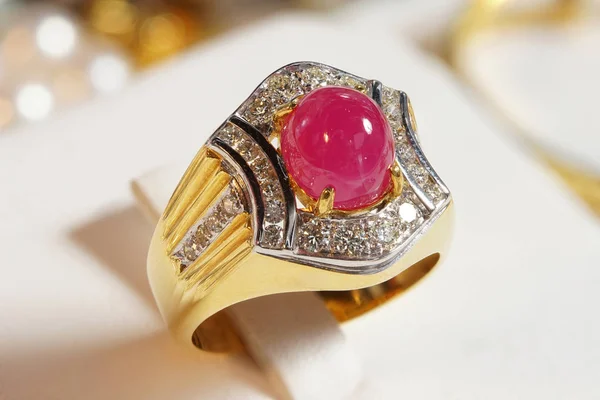 High Value Gems Stone accessories, Gold, Diamond, Ruby ring on holder. Studio lighting bokeh background, HDR stacking macro photo close up isolated